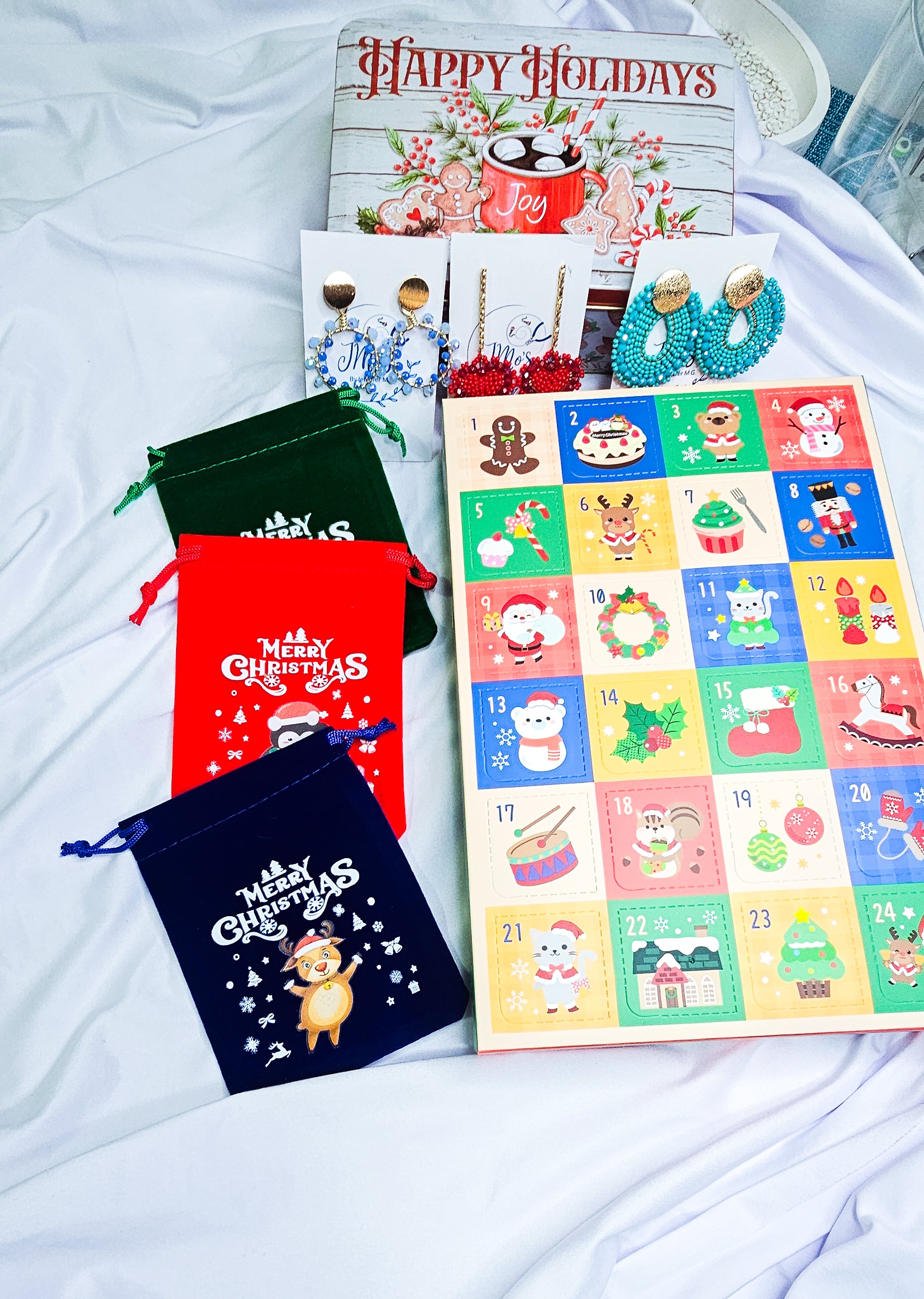 Advent calendar with Christmas-themed bags on a white surface