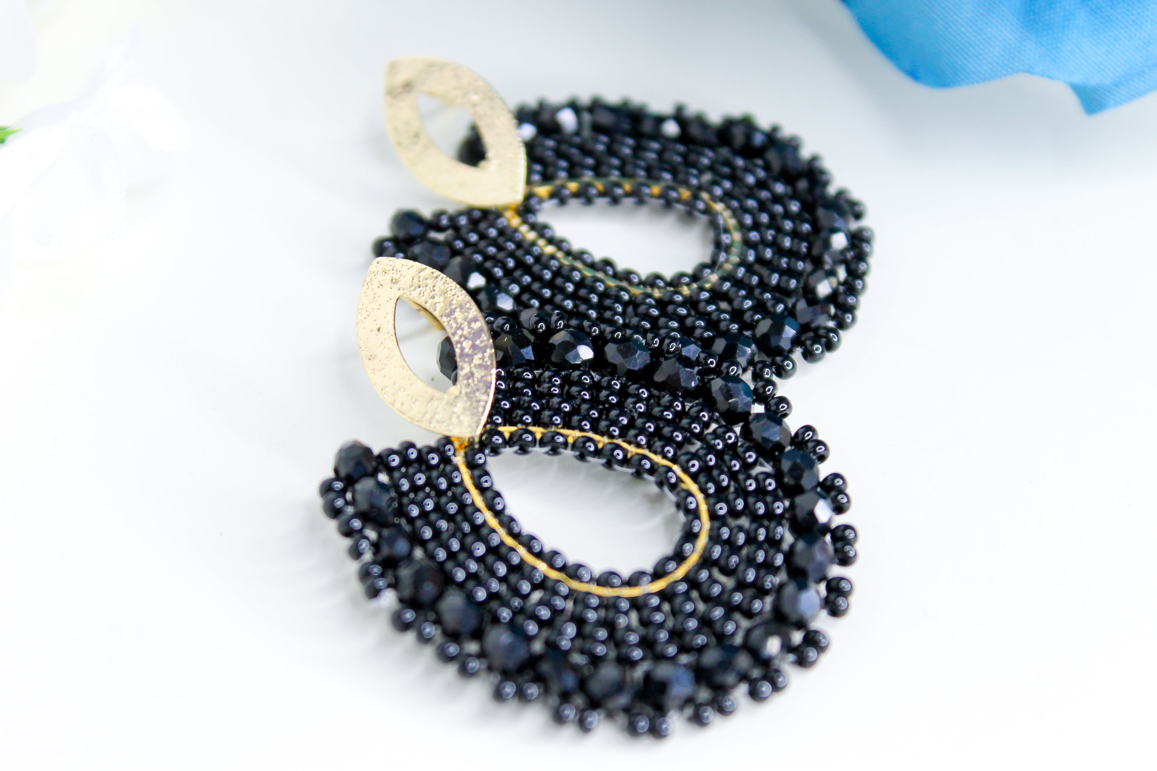 Black beaded earrings with gold accents 