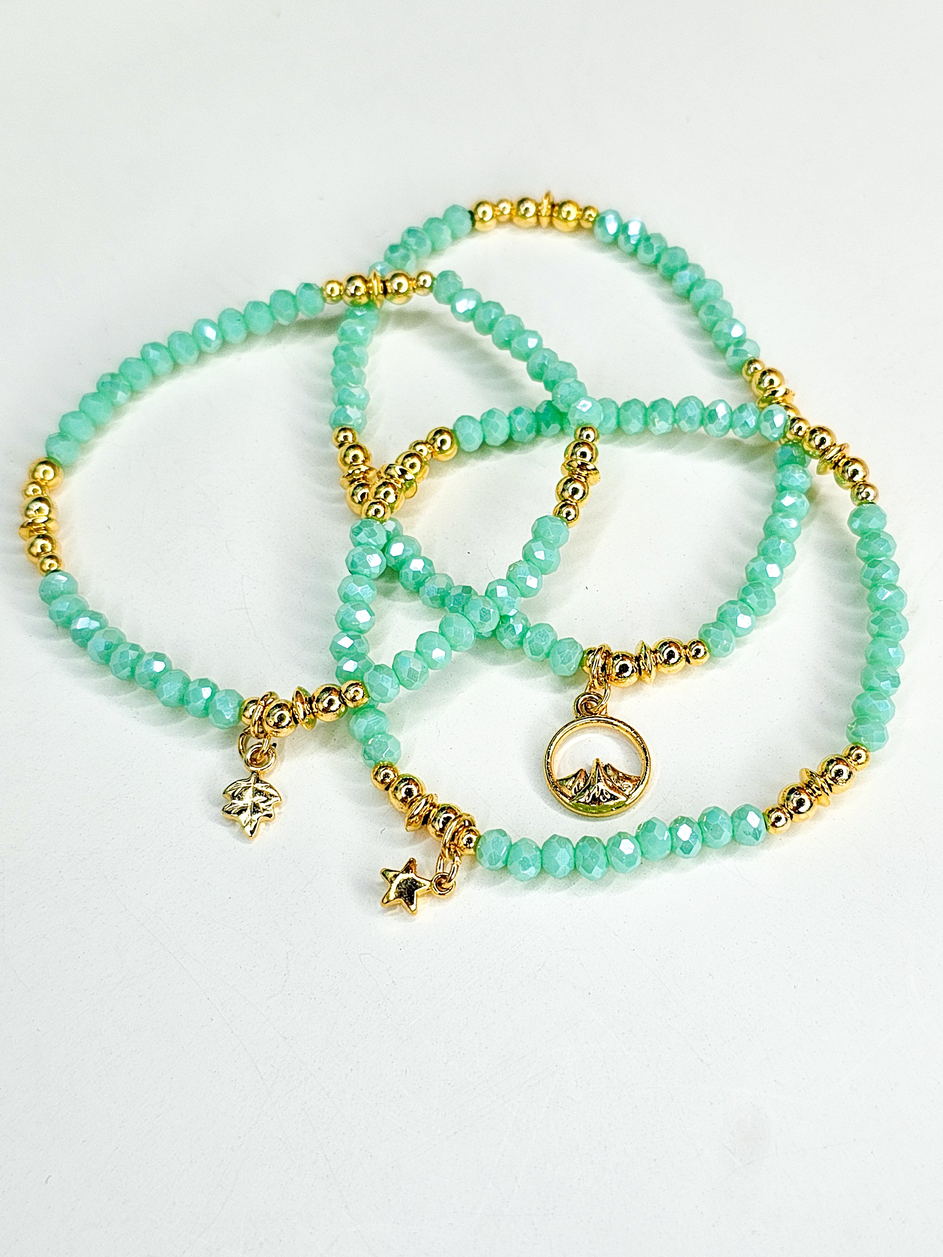 Set of turquoise beaded bracelets with gold accents 