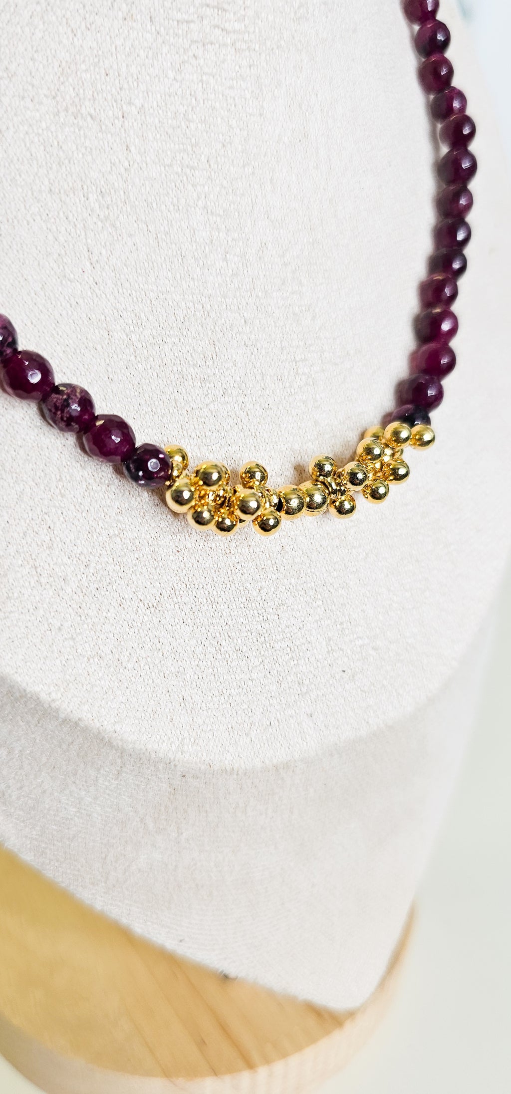Necklace with purple beads and gold clasp 