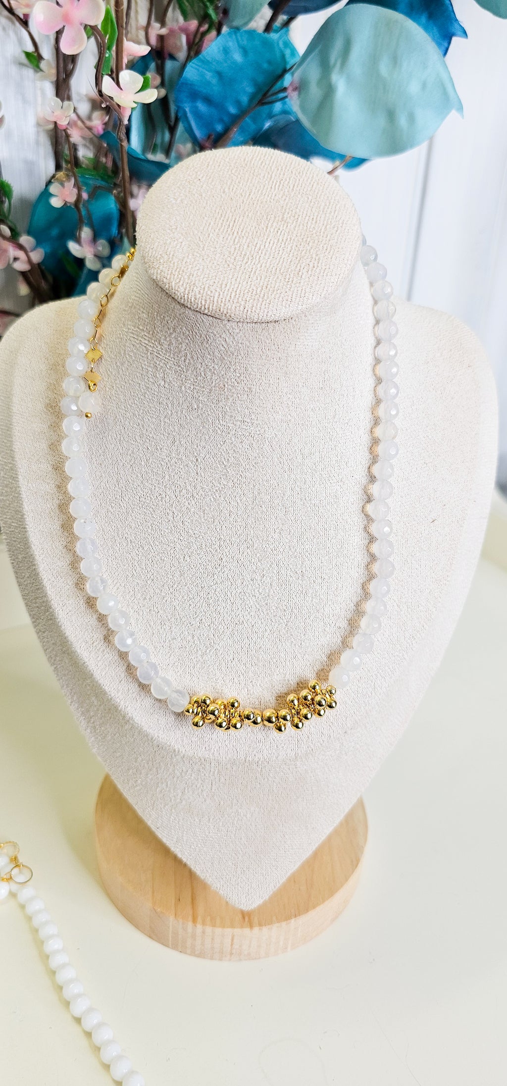 white necklace with gold 