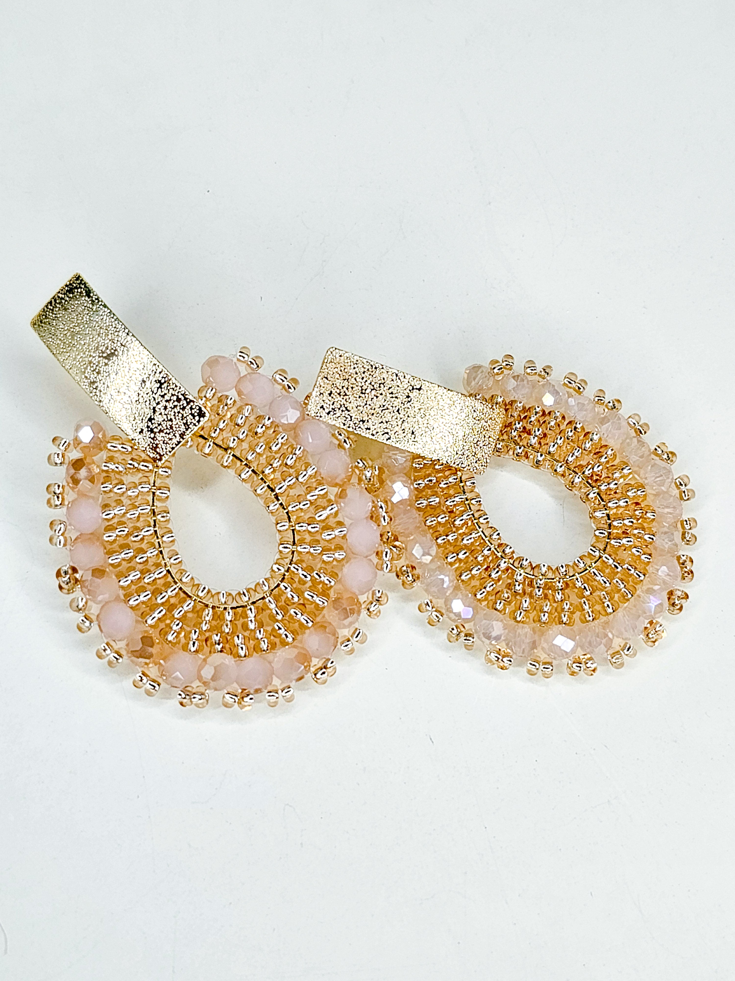 Pair of gold and pink earrings 
