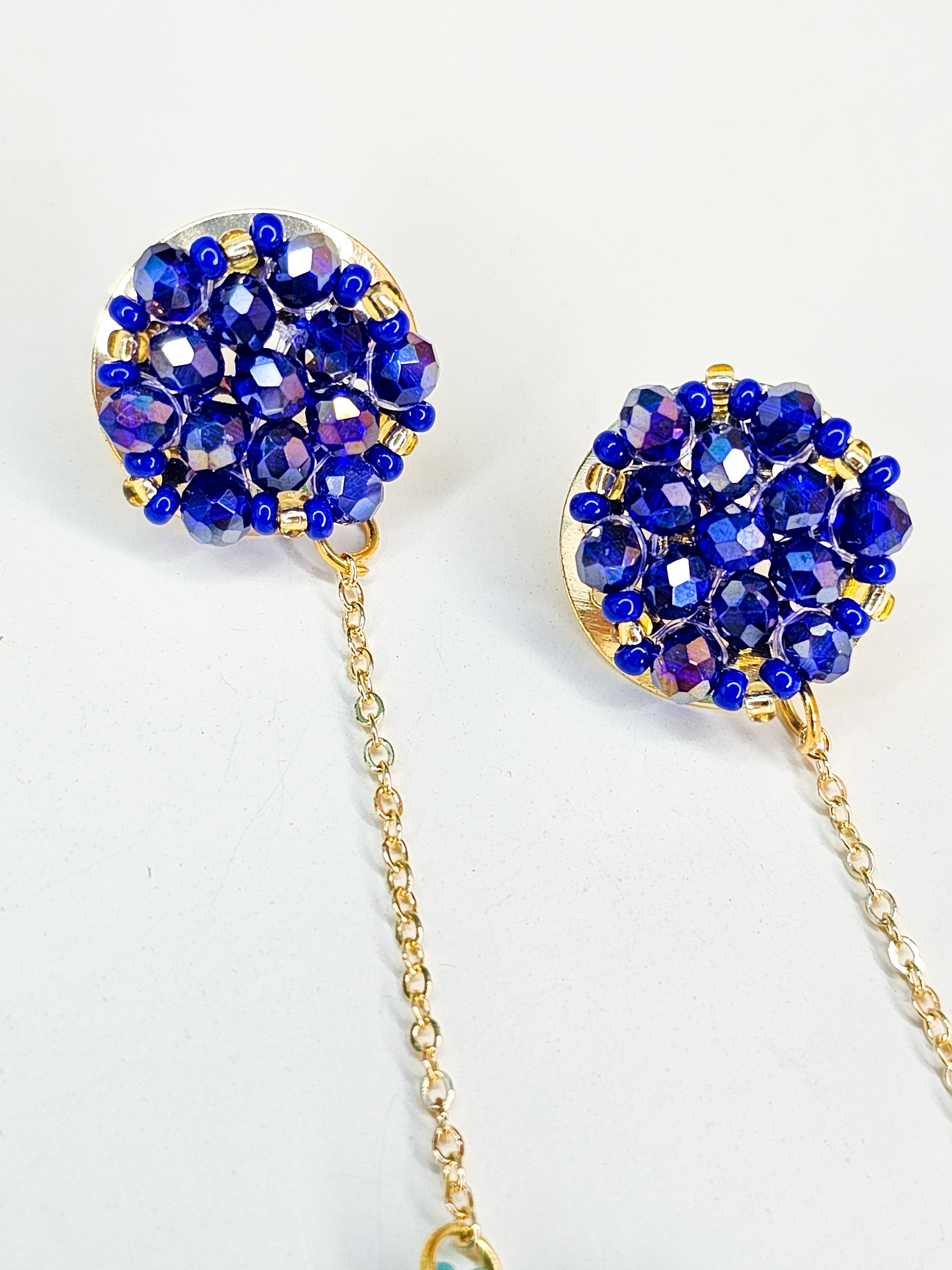 Pair of blue beaded earrings with gold chains 