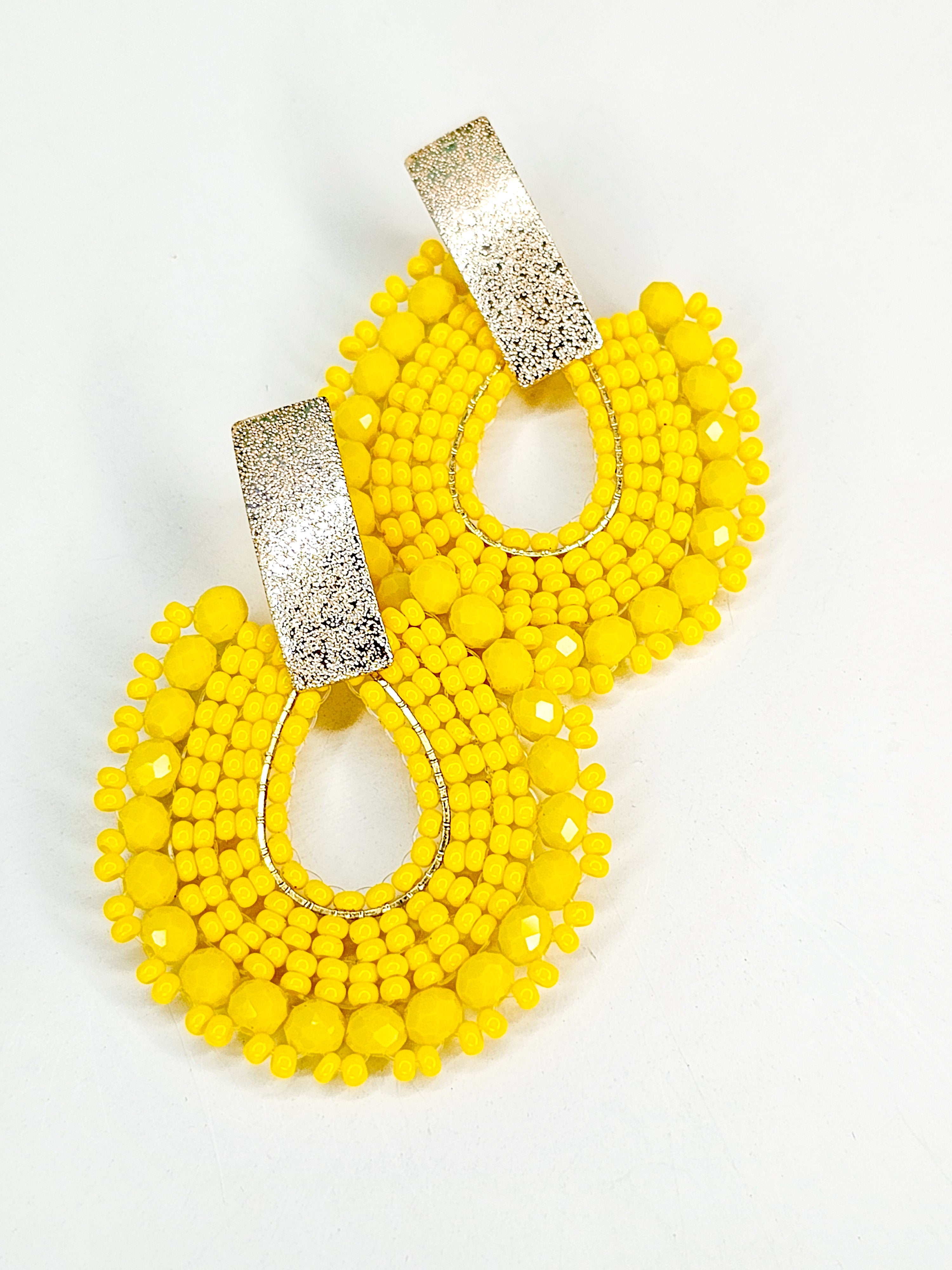 Yellow beaded earrings with gold accents 